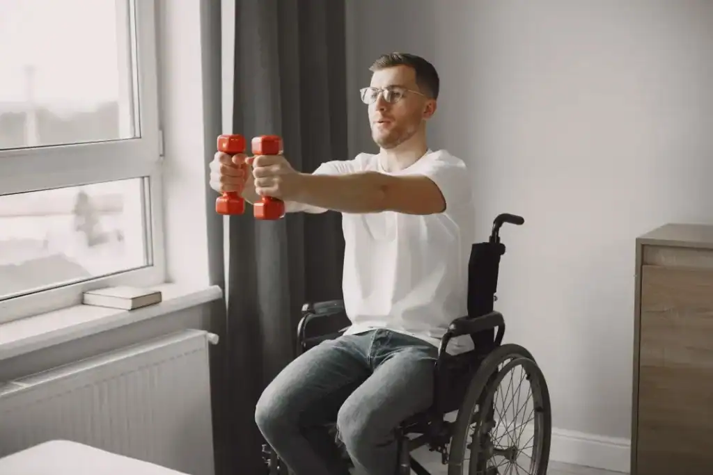 Image of man doing exercise in his wheelchair to aid weight loss Eastbourne