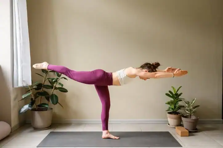 Achieving the Perfect Tone: How Often Should You Exercise for Results? 1 Woman doing Yoga exercise Eastbourne to help with toning the body.