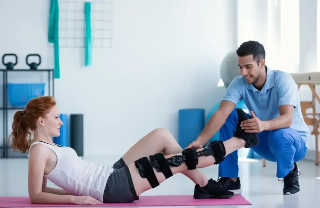Woman having treatment to help muscle recovery Eastbourne after an injury