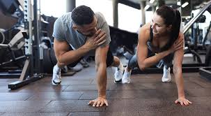 Sculpting Sleek Arms: The Essential Role of Cardio in Toning Without Bulking Up 1 Image of man and woman doing Cardio Eastbourne to tone their arms.